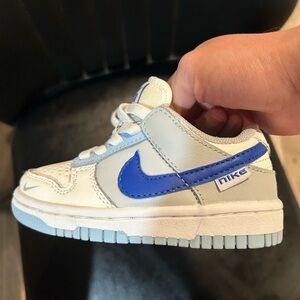 Nike Kids' Dunk Low sneakers in the Ivory Hyper Royal Blue colorway